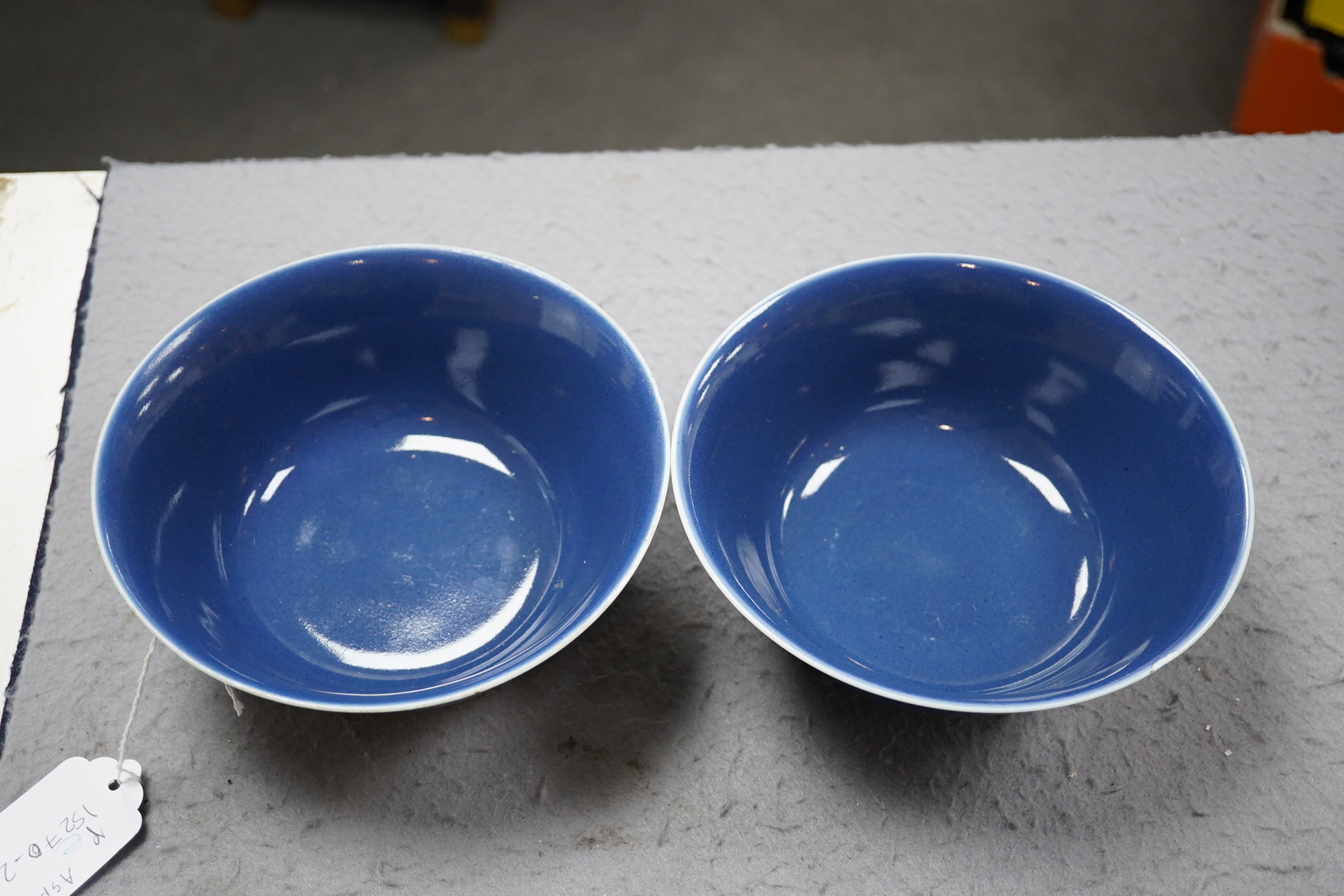 A pair of Chinese powder blue glazed bowls, Daoguang mark and of the period (1821-50)